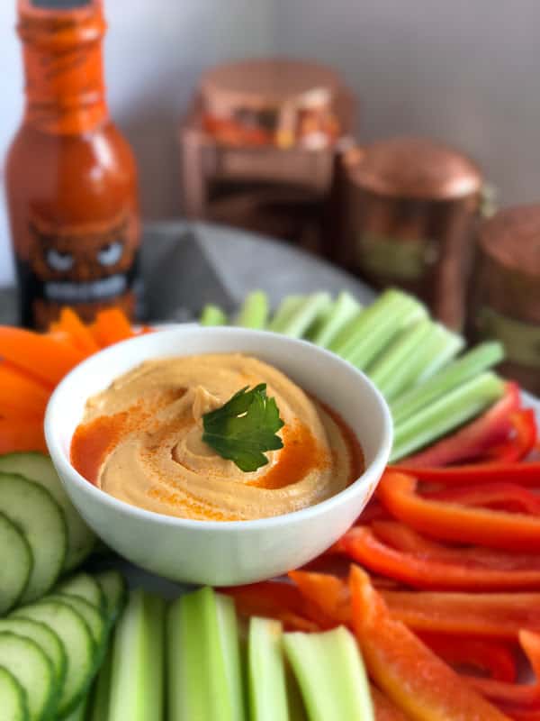 This easy buffalo dip is a crowd pleaser for vegans, paleo peeps and those doing a Whole30 reset. Bring it to a party and everyone will be your best friend! #vegan #buffalorecipes #paleo #whole30