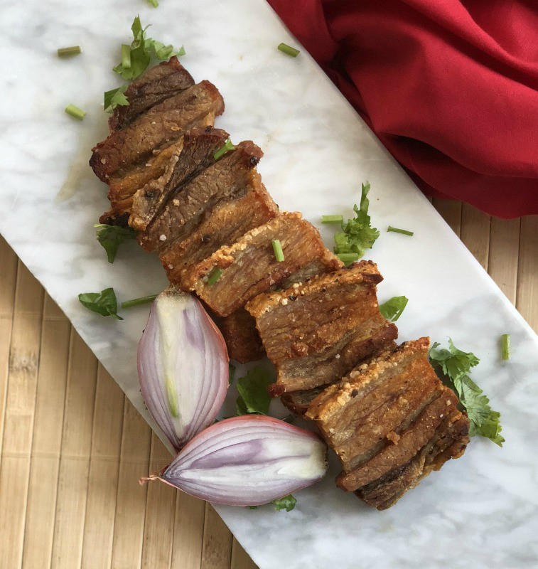This crispy pork belly is oven baked and then pan seared in ghee to make a delicious protein to go with salad or dipped in your favorite sauce. #whole30 #paleo #keto #lowcarb
