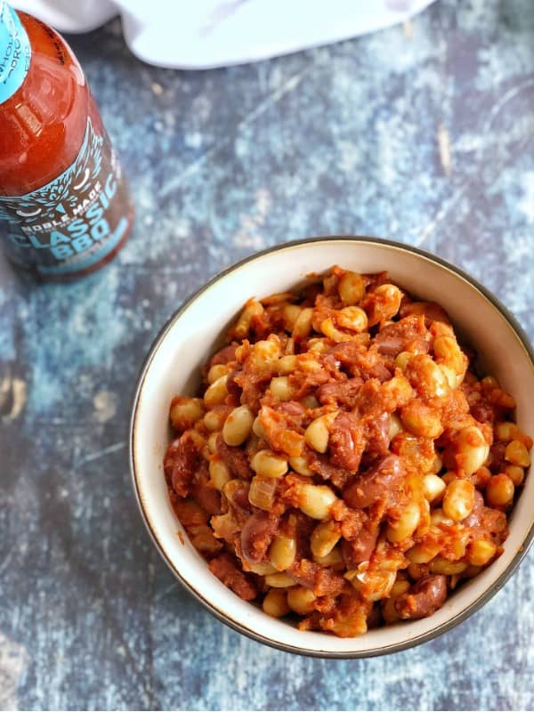 These BBQ baked beans are easy to make and can be customized to your liking by adding the sweetness and BBQ sauce of your choice.#glutenfree