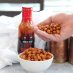 These crispy buffalo chickpeas are a healthy crunchy snack that packs a buffalo spicy kick. They can be roasted in the oven or cooked using your air fryer. 