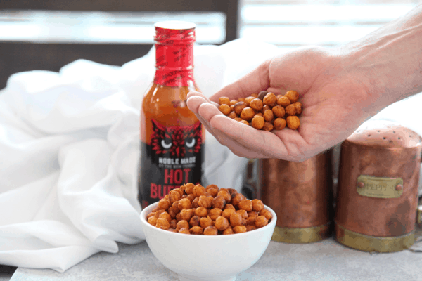 These crispy buffalo chickpeas are a healthy crunchy snack that packs a buffalo spicy kick. #vegan #glutenfree #healthysnack