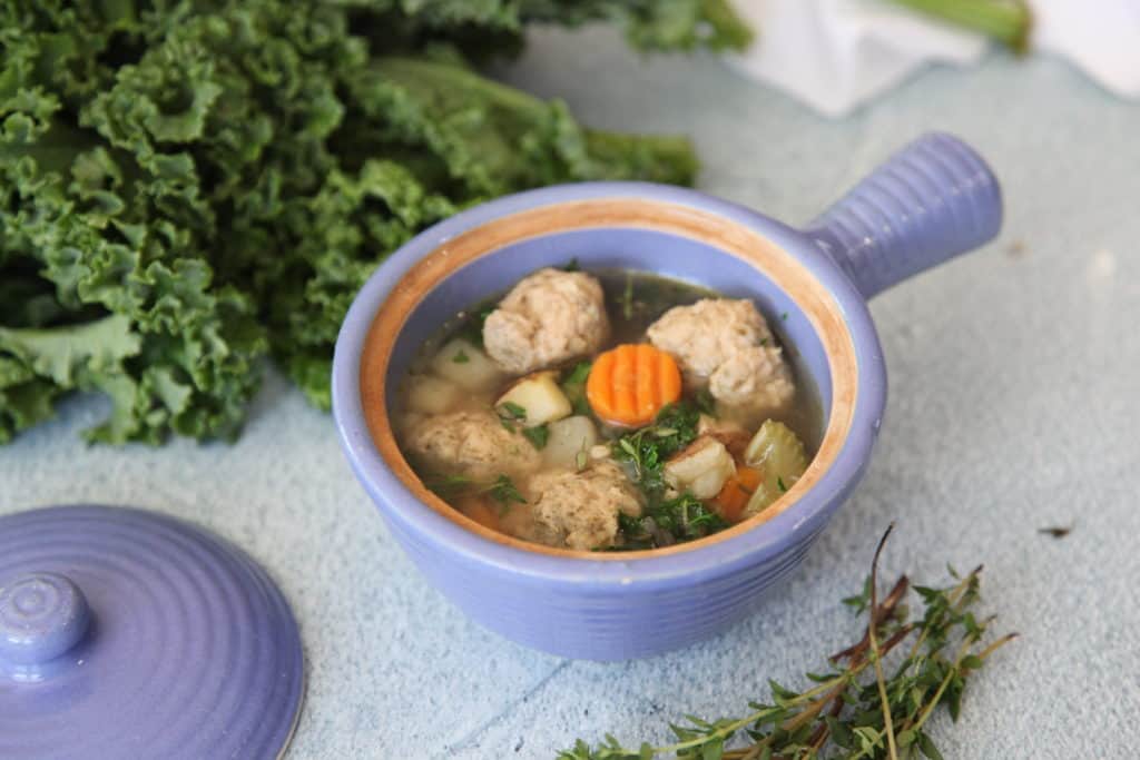 This Italian wedding soup is warming, comforting and full of clean ingredients like homemade chicken meatballs, carrots, celery, onion, potatoes and kale. Perfect for those on a paleo, or whole30 reset. 