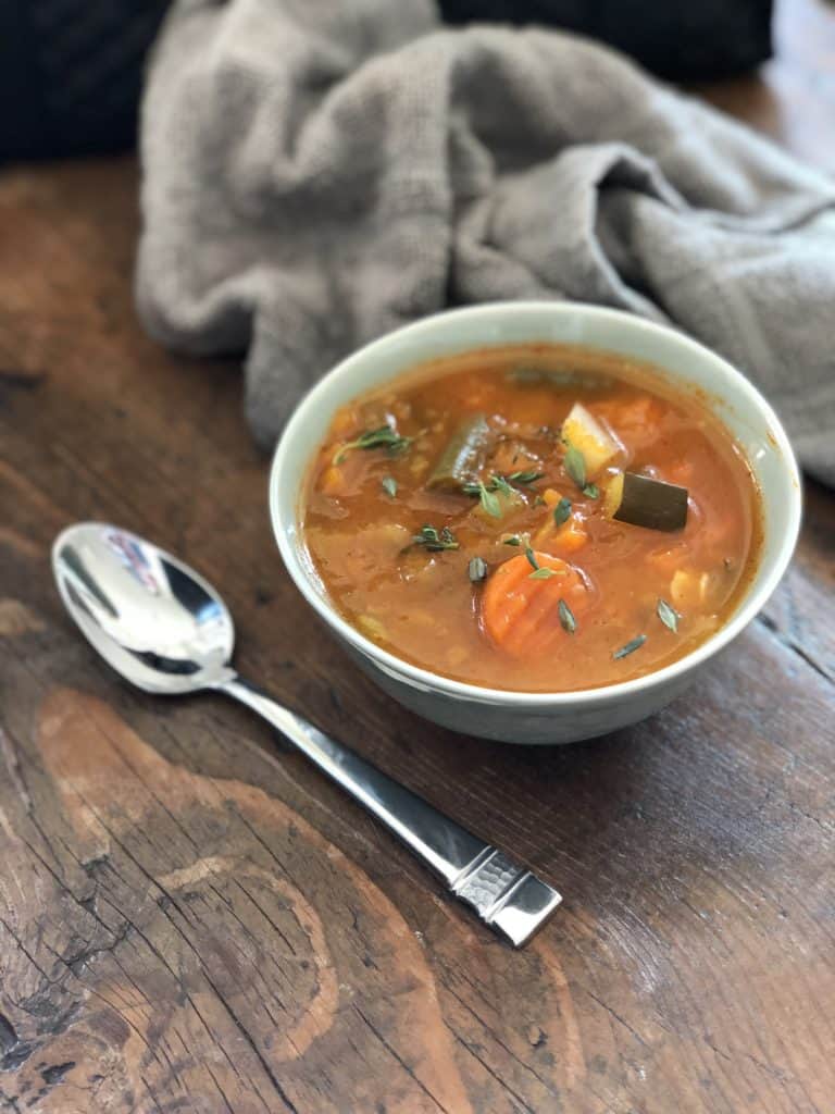 This hearty vegetable minestrone soup is perfect for colder weather and packs a nutritious veggie punch.  #paleo #vegan #whole30 #fall #soup 