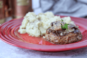 This hearty salisbury steak is an upgraded burger smothered in homemade mushroom gravy. #whole30 #paleo #keto