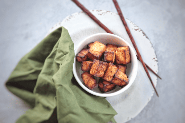 This sesame ginger tofu crisps up perfectly using the air fryer and is ready for salads, noodle bowls, rice and more. #vegan #glutenfree #airfryer #airfryerrecipe
