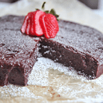 This flourless chocolate cake has simple ingredients and is easy to put together. Naturally gluten free, this cake is dense, fudgy and a hit for parties. #glutenfree #dessert #cake