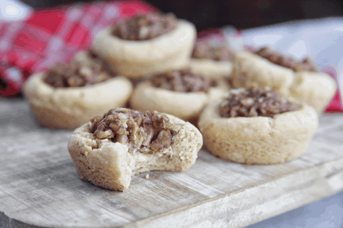 These mini pecan pie tarts are a perfect treat for those who want just a little taste of pecan pie. This recipe is made with gluten free cookie dough and a dairy free date caramel. #pecanpie #dessert #pecanpiecookie
