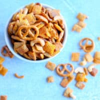 This buffalo party mix is gluten free and made with corn cereal, rice cereal, cashews and gluten free pretzels. Perfect for game day parties.