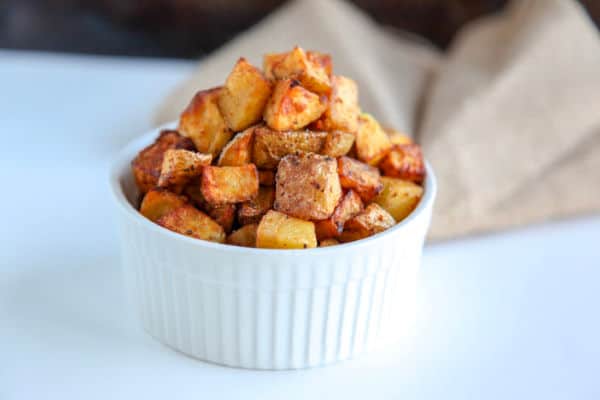 This recipe for crispy air fryer potatoes is simple and finished within 20 minutes. Using oil, seasonings and golden potatoes, the air fryer makes crispy potatoes that are a perfect side dish or breakfast side. Compliant with paleo and whole30 diets. 