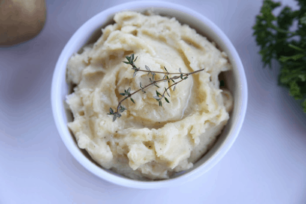 These creamy horseradish mashed potatoes add a great kick to a classic side dish using prepared horseradish. This recipe can be made on the stovetop or in your instant pot. #whole30 #paleo #sidedish