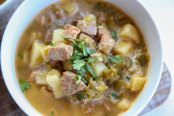 This simple pork chili verde uses pork, tomatillos, jalapenos, green chiles and golden potatoes to make a hearty green chili that is warm and comforting. This recipe can be made on the stovetop.