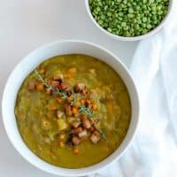 This split pea soup is a full hearty meal with lots of flavor coming from veggies and a smoky twist using ham. Perfect for cold nights or to batch cook for budget friendly meal prep. #soup #instantpot