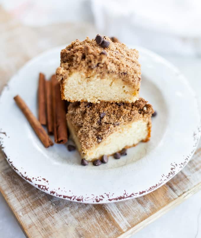gluten free coffee cake on white plate with cinnamon