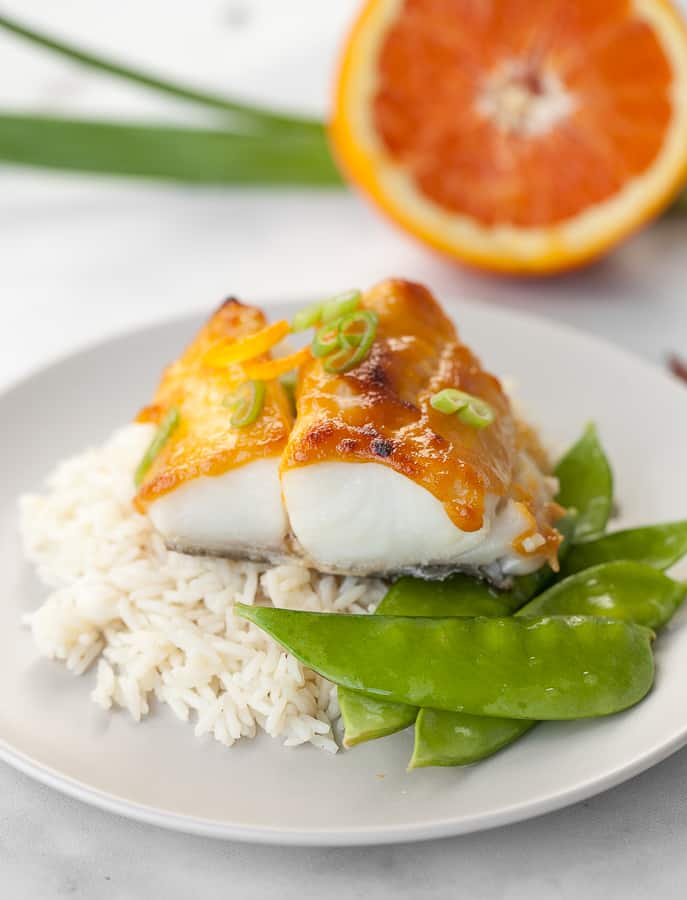 butterfish on top of rice with snap peas
