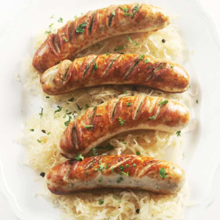 cooked bratwurst over sauerkraut