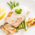 sous vide snapper on a white plate with vegetables
