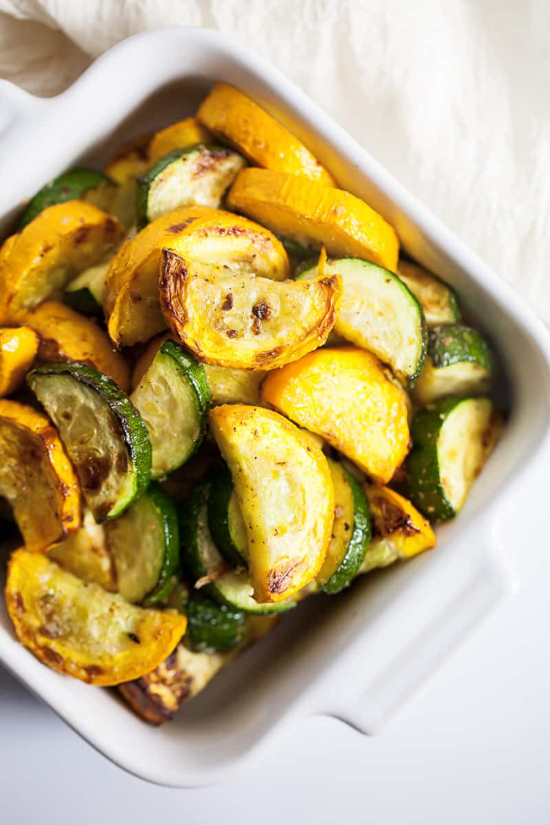 yellow squash and zucchini in a white serving dish