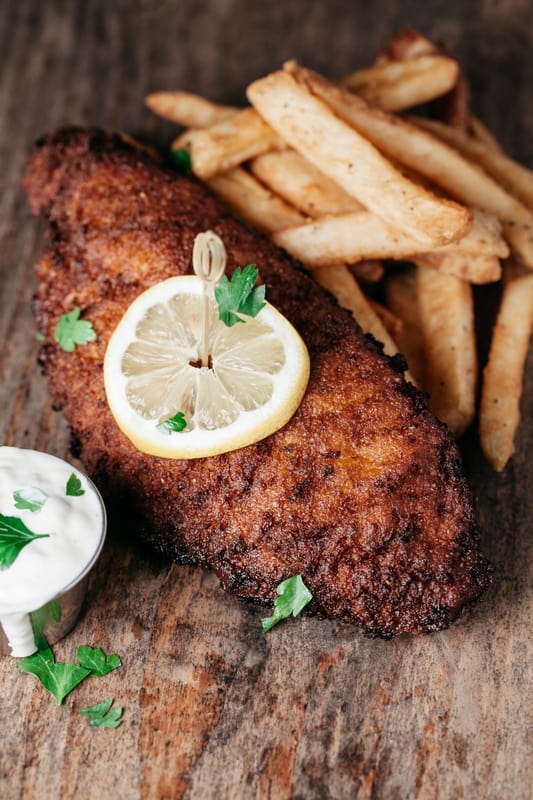fried catfish with fries and lemon