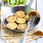 fried green tomatoes in a pan with a fork