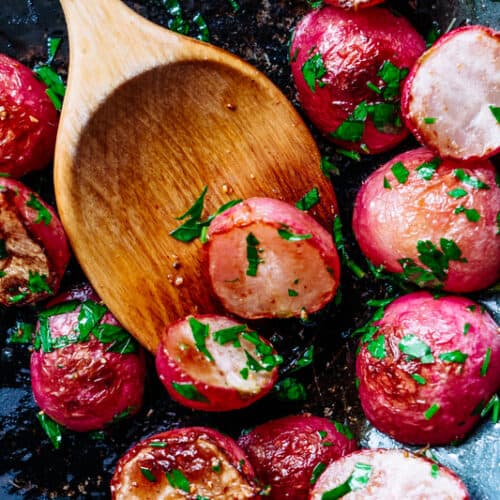 roasted radishes with a wooden spoon