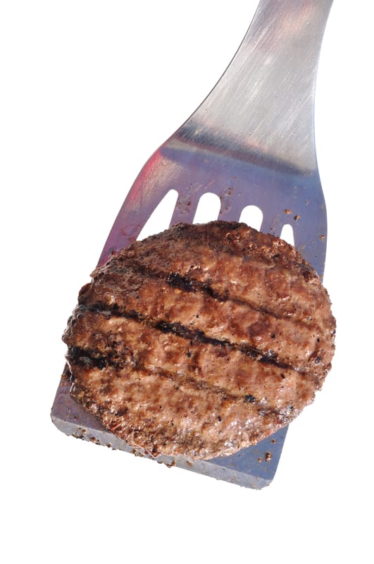cooked burger on a spatula