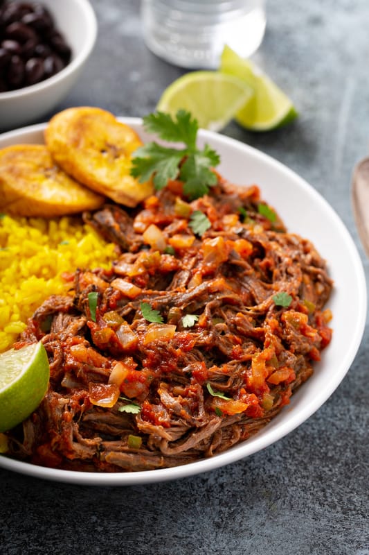 ropa vieja on a dish with plantains
