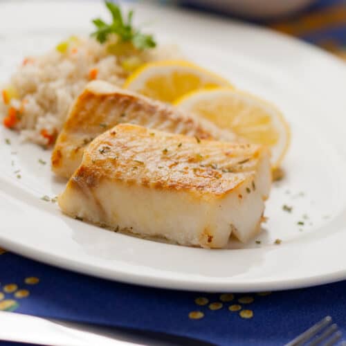 cod on a plate with a fork