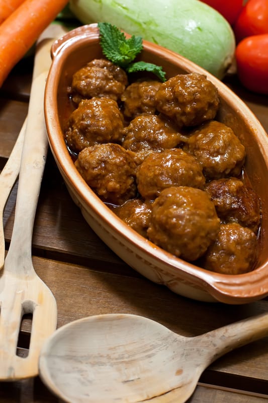 meatballs in a dish with a spoon