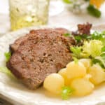 sliced venison meatloaf with potatoes