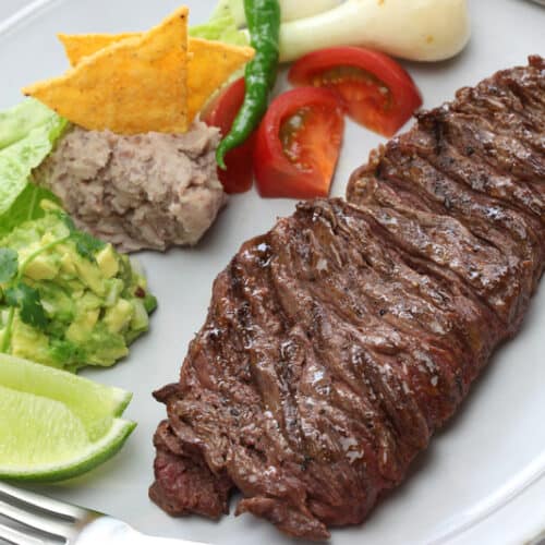 skirt steak on a plate with veggies
