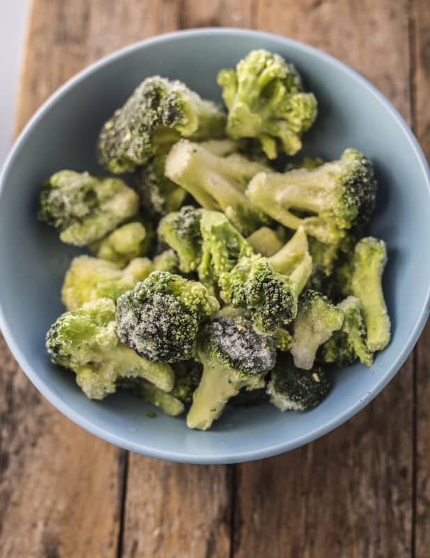 frozen broccoli in a blue bowl