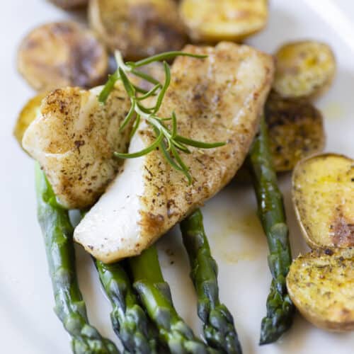 cooked cod with potatoes and asparagus