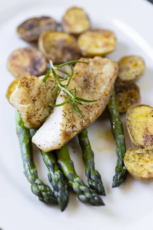 cooked cod with potatoes and asparagus