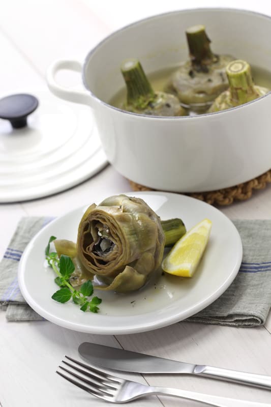 boiled artichoke on a plate