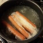 hot dogs boiling in water