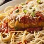 chicken parmesan with spaghetti on a plate