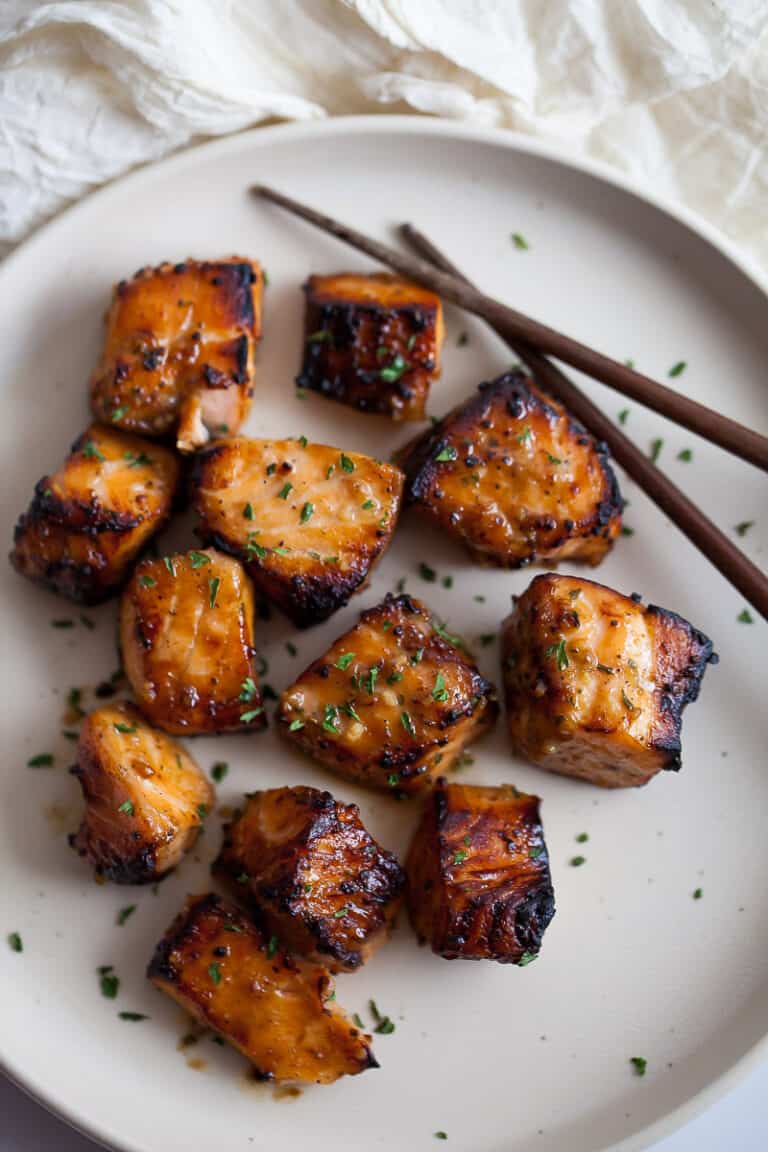 bite sized pieces of cooked salmon with honey garlic marinade